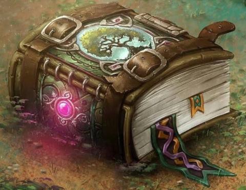 A large, leather-bound book with a glowing gem on the spine and a tree on the cover.